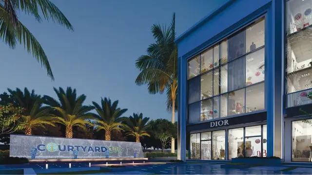 Royal Green Courtyard 37D — entrance signage at dusk (design render)